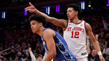 Mar 15, 2025; New York, NY, USA; St. John's Red Storm guard RJ Luis Jr. (12) celebrates his three point shot against Creighton Bluejays forward Jasen Green (0) during the second half at Madison Square Garden. Mandatory Credit: Brad Penner-Imagn Images