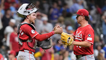Sep 26, 2025; Milwaukee, Wisconsin, USA;  Cincinnati Reds catcher Tyler Stephenson (37) greets pitcher Emilio Pagan (15) following the game against the Milwaukee Brewers at American Family Field. Mandatory Credit: Jeff Hanisch-Imagn Images