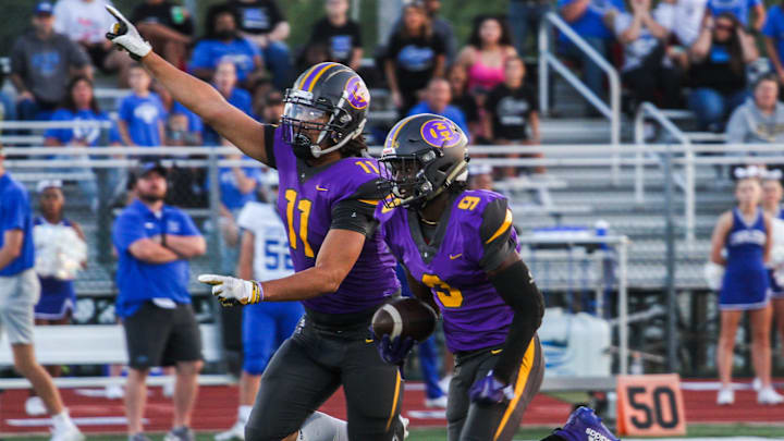 Hickman's Brock Camp (11) celebrates as Tionne Milo (9) runs in for an 86-yard touchdown during a game against Captial City at Hickman High School on Sept. 8, 2023, in Columbia, Mo. Friday, Hickman had his own long touchdown reception which is nominated for this week's Missouri High School Football Play of the Week.