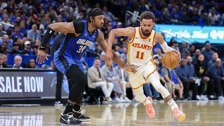 Atlanta Hawks guard Trae Young (11) is guarded by Orlando Magic center Wendell Carter Jr. (34) in the second quarter at Kia Center. Atlanta Hawks guard Trae Young (11) is guarded by Orlando Magic center Wendell Carter Jr. (34) in the second quarter at Kia Center.
