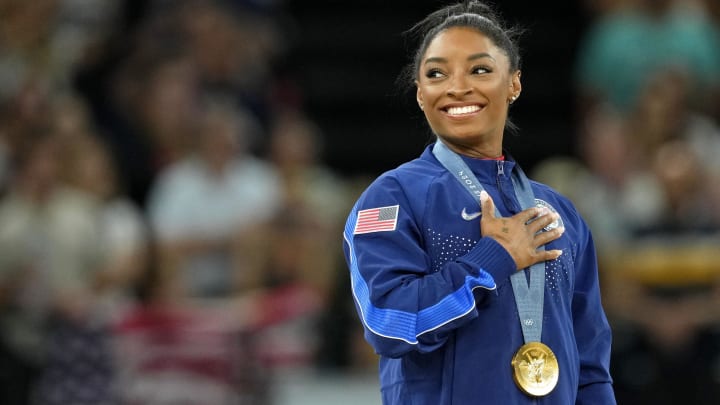 Simone Biles of the United States during the national anthem with her gold medal for vault during the Paris 2024 Olympic Summer Games