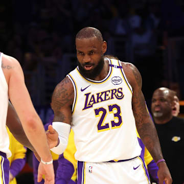 Mar 2, 2025; Los Angeles, California, USA; Los Angeles Lakers forward LeBron James (23) and guard Luka Doncic (77) react after a play during the first quarter against the LA Clippers at Crypto.com Arena. Mandatory Credit: Jason Parkhurst-Imagn Images