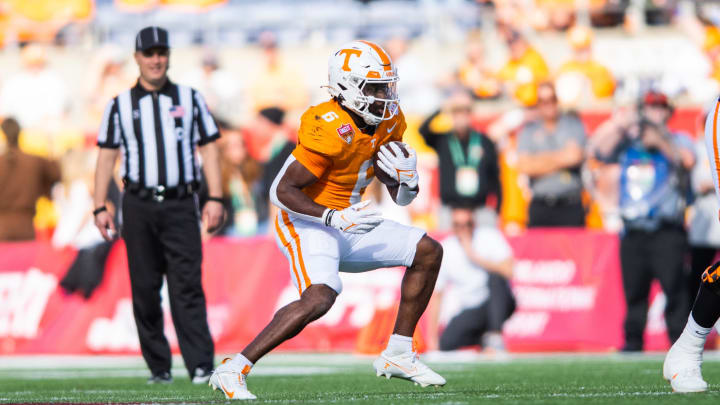 Jan 1, 2024; Orlando, FL, USA; Tennessee Volunteers running back Dylan Sampson (6) runs the ball against the Iowa Hawkeyes in the third quarter at Camping World Stadium. Mandatory Credit: Jeremy Reper-USA TODAY Sports