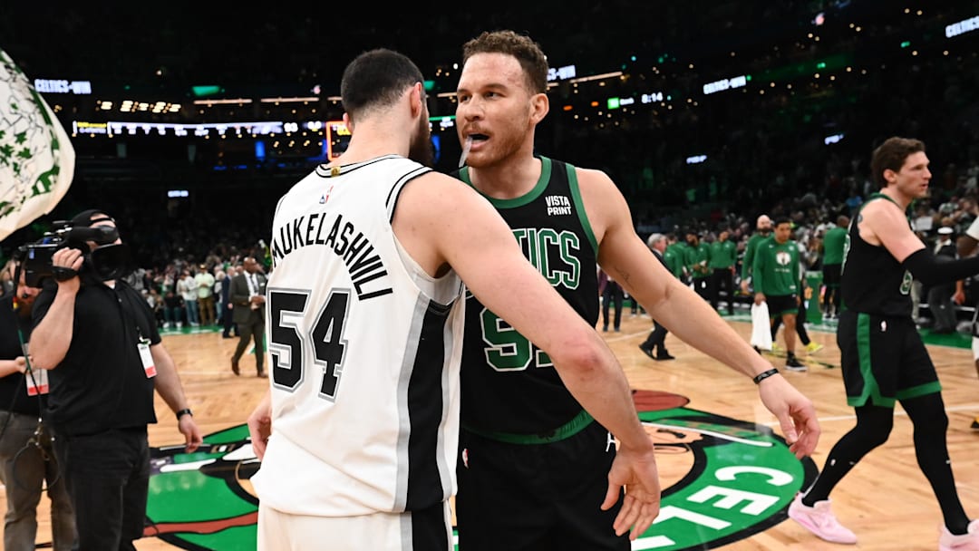 Mar 26, 2023; Boston, Massachusetts, USA; Boston Celtics forward Blake Griffin (91) hugs San Antonio Spurs forward Sandro Mamukelashvili (54) after a game at the TD Garden. Mandatory Credit: Brian Fluharty-Imagn Images