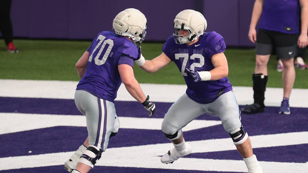 Kansas State sophomore offensive lineman Gus Hawkins (70) works on a drill with sophomore offensive lineman Ryan Howard (72) during practice on Tuesday, April 21, 2026. Kansas State sophomore offensive lineman Gus Hawkins (70) works on a drill with sophomore offensive lineman Ryan Howard (72) during practice on Tuesday, April 21, 2026.