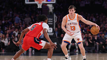 Mar 22, 2025; New York, New York, USA; New York Knicks guard Tyler Kolek (13) dribbles as Washington Wizards guard Bub Carrington (8) defends during the first half at Madison Square Garden. Mandatory Credit: Vincent Carchietta-Imagn Images