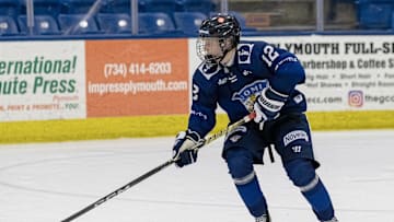 Feb 7, 2024; Plymouth, MI, USA; Finland's Aatos Koivu (12) skates up ice with the puck against USA during the third period of the 2024 U18 s Five Nations Tournament at USA Hockey Arena. Mandatory Credit: David Reginek-Imagn Images