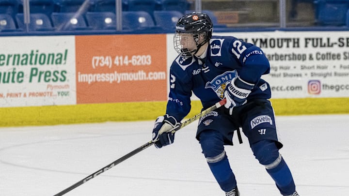 Feb 7, 2024; Plymouth, MI, USA; Finland's Aatos Koivu (12) skates up ice with the puck against USA during the third period of the 2024 U18 s Five Nations Tournament at USA Hockey Arena. Mandatory Credit: David Reginek-Imagn Images