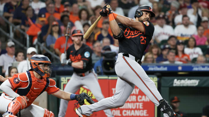 Jun 21, 2024; Houston, Texas, USA; Baltimore Orioles right fielder Anthony Santander (25) hits a RBI single against the Houston Astros in the third inning at Minute Maid Park.