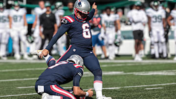 Sep 19, 2021; East Rutherford, New Jersey, USA; New England Patriots kicker Nick Folk (6) kicks a field goal as punter Jake Bailey (7) holds during the second half against the New England Patriots at MetLife Stadium. Mandatory Credit: Vincent Carchietta-Imagn Images