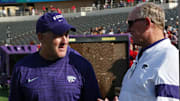 Oct 23, 2021; Lubbock, Texas, USA;  Kansas State Wildcats Chris Klieman visits with Kansas State Director of Athletics Gene Taylor before the game against the Texas Tech Red Raiders at Jones AT&T Stadium. Mandatory Credit: Michael C. Johnson-Imagn Images