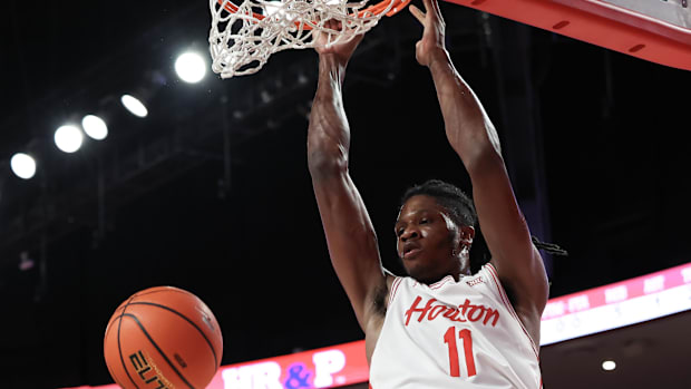 Houston Cougars forward Joseph Tugler (11) dunks against the Jackson State Tigers.