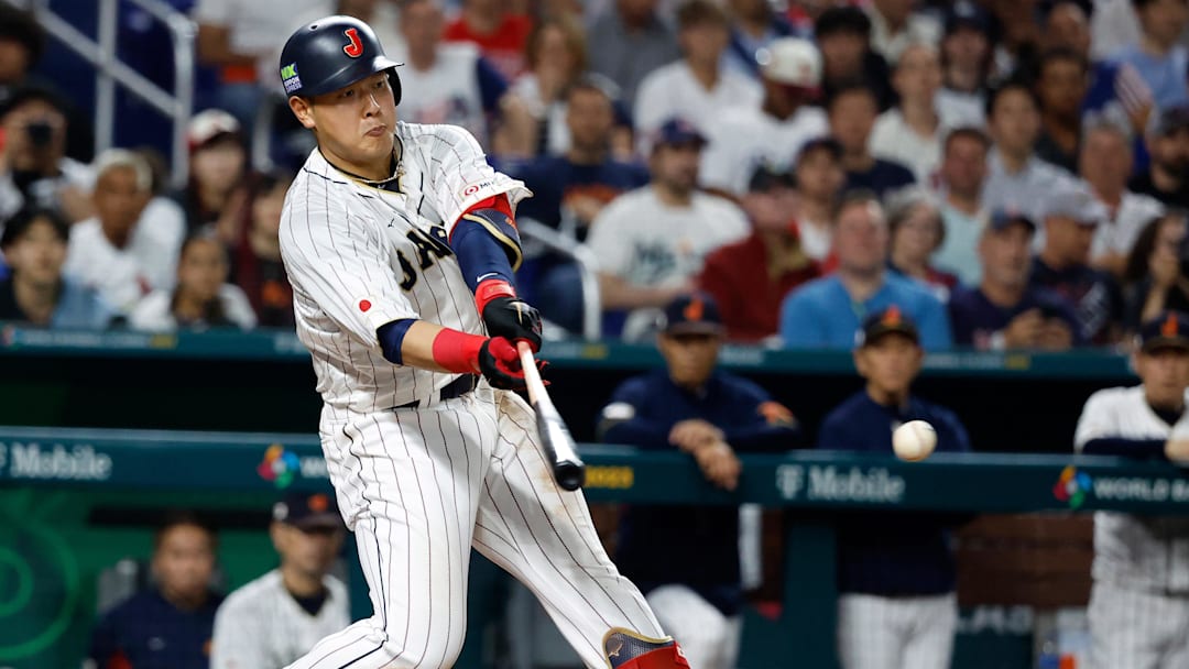 Mar 21, 2023; Miami, Florida, USA; Japan first baseman Kazuma Okamoto (25) bats against the USA in the sixth inning at LoanDepot Park. Mandatory Credit: Rhona Wise-Imagn Images