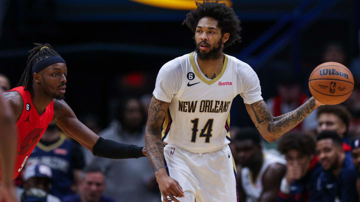 Nov 10, 2022; New Orleans, Louisiana, USA; New Orleans Pelicans forward Brandon Ingram (14) dribbles against Portland Trail Blazers forward Jerami Grant (9) during the first half at Smoothie King Center. Mandatory Credit: Stephen Lew-USA TODAY Sports