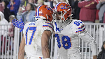 Nov 30, 2024; Tallahassee, Florida, USA; Florida Gators wide receiver Chimere Dike (17) and Marcus Burke (88) celebrate a touchdown during the second half against the at Doak S. Campbell Stadium. Mandatory Credit: Melina Myers-Imagn Images