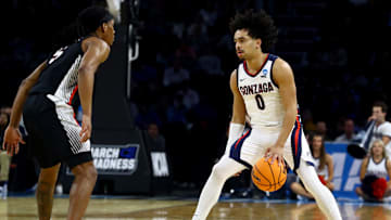 Mar 20, 2025; Wichita, KS, USA; Gonzaga Bulldogs guard Ryan Nembhard (0) dribbles against Georgia Bulldogs guard Silas Demary Jr. (5) in the first half of a first round men’s NCAA Tournament game at Intrust Bank Arena. Mandatory Credit: Nick Tre. Smith-Imagn Images