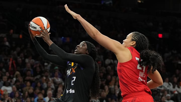 Jul 23, 2025; Phoenix, Arizona, USA; Phoenix Mercury guard Kahleah Copper (2) drives past Atlanta Dream forward Brionna Jones (24) in the second half at Footprint Center. Mandatory Credit: Rick Scuteri-Imagn Images