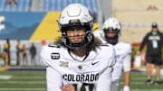 Nov 8, 2025; Morgantown, West Virginia, USA; Colorado Buffaloes quarterback Julian Lewis (10) warms up prior to their game against the West Virginia Mountaineers at Milan Puskar Stadium. Mandatory Credit: Ben Queen-Imagn Images
