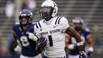 Sep 30, 2023; East Hartford, Connecticut, USA; Utah State Aggies wide receiver Jalen Royals (1) runs the ball for a touchdown against the UConn Huskies in the second half at Rentschler Field at Pratt & Whitney Stadium. Mandatory Credit: David Butler II-Imagn Images