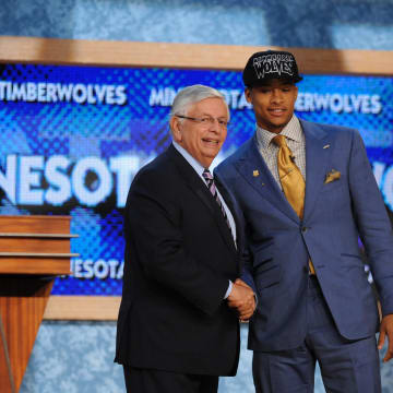 Jun 27, 2013; Brooklyn, NY, USA; Trey Burke (Michigan) poses with NBA commisioner David Stern after being selected as the number nine overall pick to the Minnesota Timberwolves during the 2013 NBA Draft at the Barclays Center. Mandatory Credit: Joe Camporeale-USA TODAY Sports