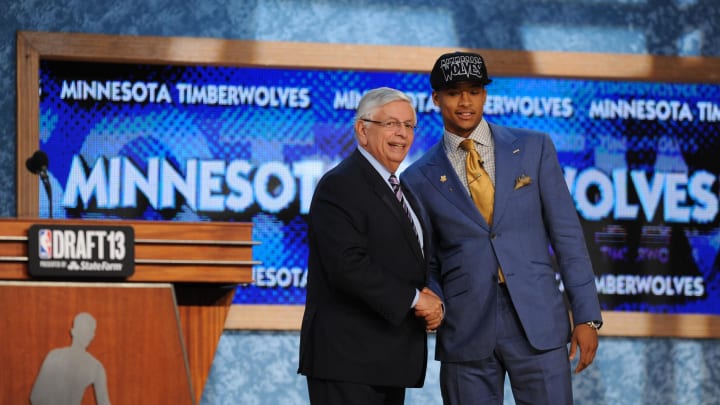 Jun 27, 2013; Brooklyn, NY, USA; Trey Burke (Michigan) poses with NBA commisioner David Stern after being selected as the number nine overall pick to the Minnesota Timberwolves during the 2013 NBA Draft at the Barclays Center. Mandatory Credit: Joe Camporeale-USA TODAY Sports