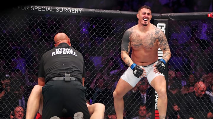 Nov 11, 2023; New York, NY, USA; Tom Aspinall (blue gloves) reacts to beating Sergei Pavlovich (red gloves) during UFC 295 at Madison Square Garden. Mandatory Credit: Wendell Cruz-USA TODAY Sports