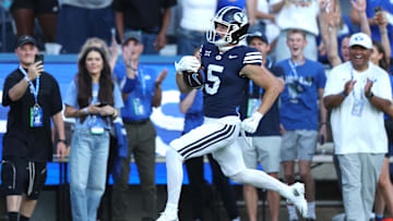 Aug 30, 2025; Provo, Utah, USA; Brigham Young Cougars wide receiver Cody Hagen (5) runs for a touchdown against the Portland State Vikings during the second quarter at LaVell Edwards Stadium. Mandatory Credit: Rob Gray-Imagn Images
