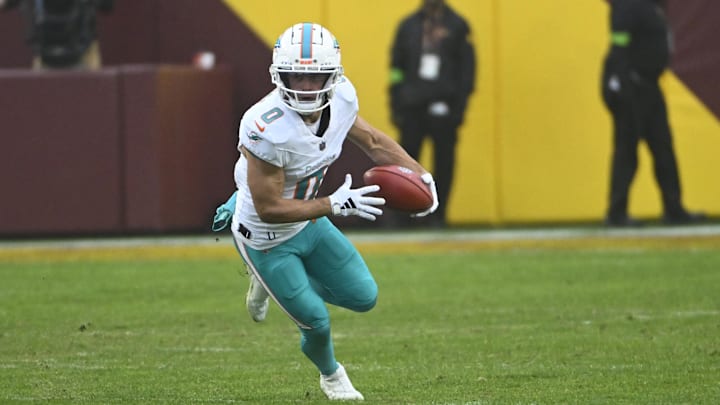 Dec 3, 2023; Landover, Maryland, USA; Miami Dolphins wide receiver Braxton Berrios (0) returns a punt against the Washington Commanders during the second half at FedExField. Mandatory Credit: Brad Mills-Imagn Images Dec 3, 2023; Landover, Maryland, USA; Miami Dolphins wide receiver Braxton Berrios (0) returns a punt against the Washington Commanders during the second half at FedExField. Mandatory Credit: Brad Mills-Imagn Images