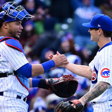 Apr 9, 2022; Chicago, Illinois, USA; Chicago Cubs catcher Willson Contreras (40) and Chicago Cubs relief pitcher Ethan Roberts (21) celebrate after securing the 9-0 win against the Milwaukee Brewers at Wrigley Field.
