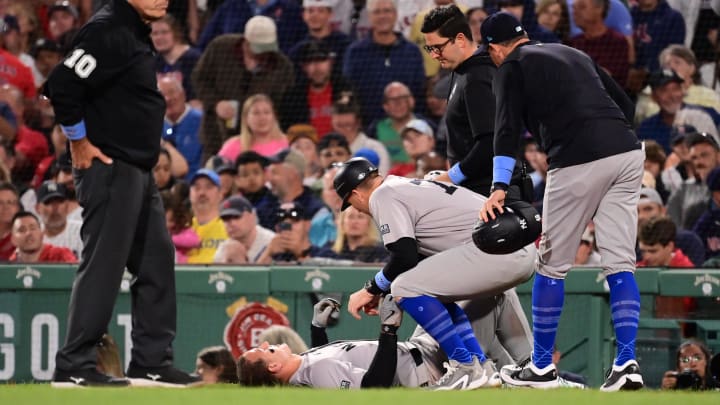 Jun 16, 2024; Boston, Massachusetts, USA; New York Yankees first baseman Anthony Rizzo (48) is checked by medical staff during the seventh inning at Fenway Park. Mandatory Credit: Eric Canha-USA TODAY Sports