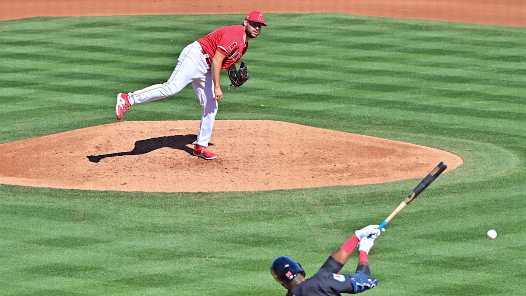 Angels starting pitcher Chase Silseth (63) throws to Cleveland Guardians right fielder Estevan Florial (90) in the fourth inning during a spring training game at Tempe Diablo Stadium on Feb. 29, 2024.