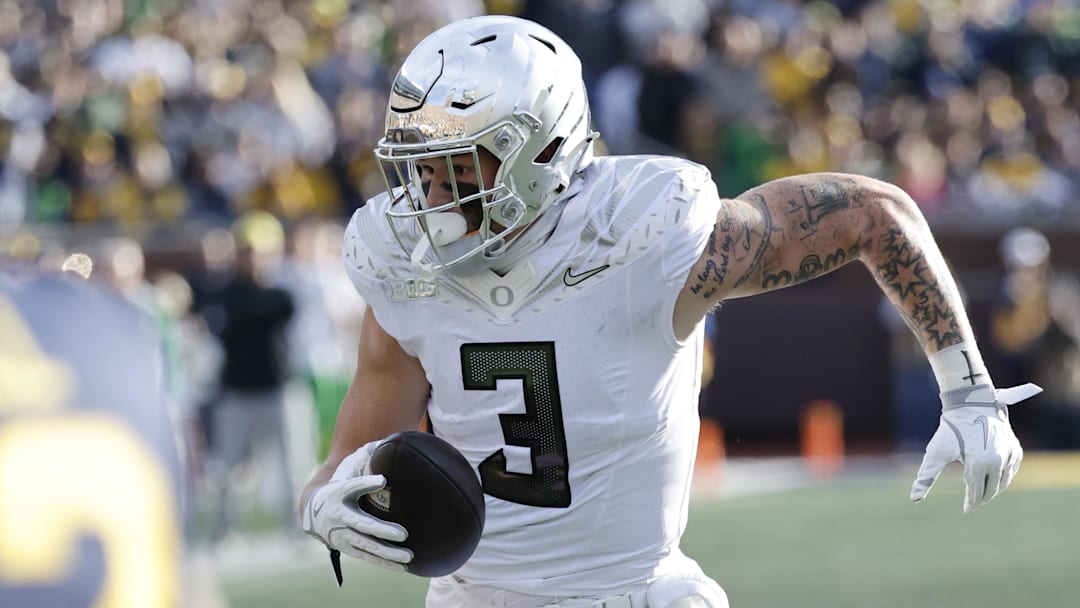 Nov 2, 2024; Ann Arbor, Michigan, USA;  Oregon Ducks tight end Terrance Ferguson (3) runs the ball in the first half against the Michigan Wolverines at Michigan Stadium. Mandatory Credit: Rick Osentoski-Imagn Images