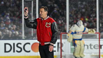 Dec 31, 2024; Chicago, Illinois, USA; Chris Chelios, former player for the Chicago Blackhawks, participates in the ceremonial puck drop before the Winter Classic against the St. Louis Blues at Wrigley Field. Mandatory Credit: Daniel Bartel-Imagn Images