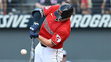Sep 28, 2025; Cleveland, Ohio, USA;  Cleveland Guardians first baseman Kyle Manzardo (9) hits a double against the Texas Rangers during the eighth inning at Progressive Field. Mandatory Credit: Ken Blaze-Imagn Images