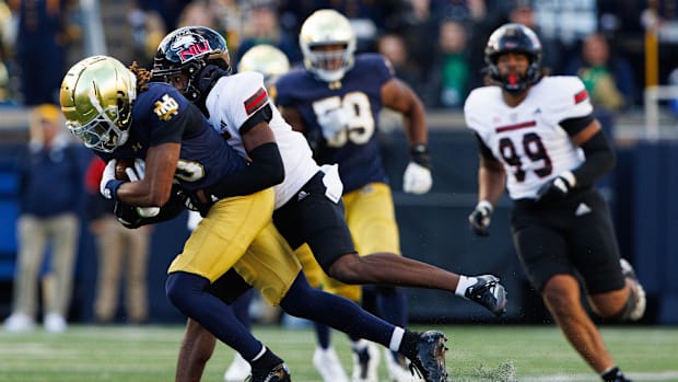 Northern Illinois cornerback Jacob Finley brings down Notre Dame wide receiver Kris Mitchell during a NCAA college football g