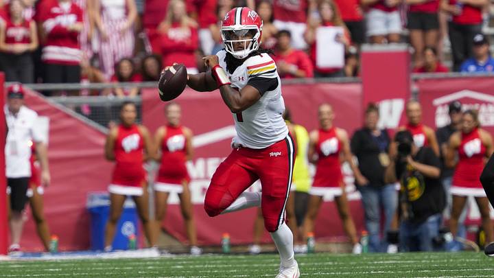 Sep 20, 2025; Madison, Wisconsin, USA;  Maryland Terrapins' Malik Washington (7) scrambles with the football during the second quarter against the Wisconsin Badgers at Camp Randall Stadium. Mandatory Credit: Jeff Hanisch-Imagn Images