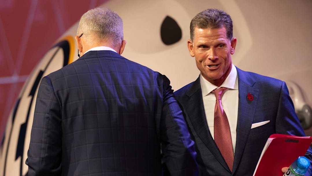 Oklahoma head coach Brent Venables shaking hands with SEC commissioner Greg Sankey
