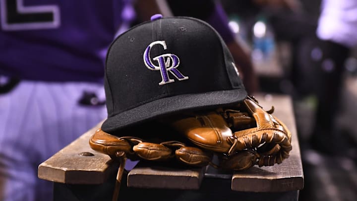 Aug 4, 2017; Denver, CO, USA; General view of the hat and glove of Colorado Rockies shortstop Pat Valaika (4) (not pictured) in the seventh inning against the Philadelphia Phillies at Coors Field. 