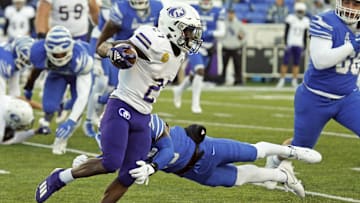 Nov 19, 2022; Memphis, Tennessee, USA; North Alabama Lions running back ShunDerrick Powell (27) runs the ball during the second half against the Memphis Tigers at Simmons Bank Liberty Stadium. Mandatory Credit: Petre Thomas-Imagn Images