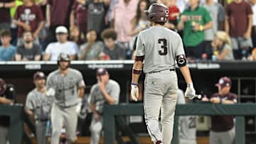 Jun 24, 2024; Omaha, NE, USA;  Texas A&M Aggies second baseman Kaeden Kent (3) walks back to the dugout after striking out against the Tennessee Volunteers during the eighth inning at Charles Schwab Field Omaha. Mandatory Credit: Steven Branscombe-Imagn Images
