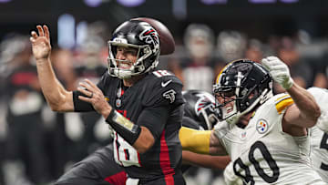 Sep 8, 2024; Atlanta, Georgia, USA; Pittsburgh Steelers linebacker T.J. Watt (90) strips the ball from Atlanta Falcons quarterback Kirk Cousins (18) at Mercedes-Benz Stadium. Mandatory Credit: Dale Zanine-Imagn Images