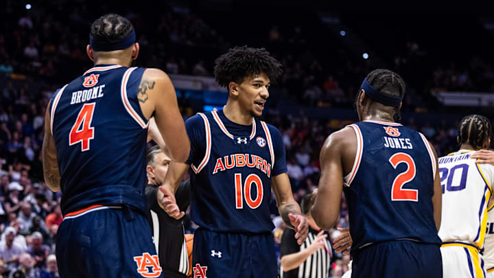 Jan 29, 2025; Baton Rouge, Louisiana, USA;  Auburn Tigers guard Chad Baker-Mazara (10) and guard Denver Jones (2) and forward Johni Broome (4) looks on again LSU Tigers forward Derek Fountain (20) during the second half at Pete Maravich Assembly Center. Mandatory Credit: Stephen Lew-Imagn Images