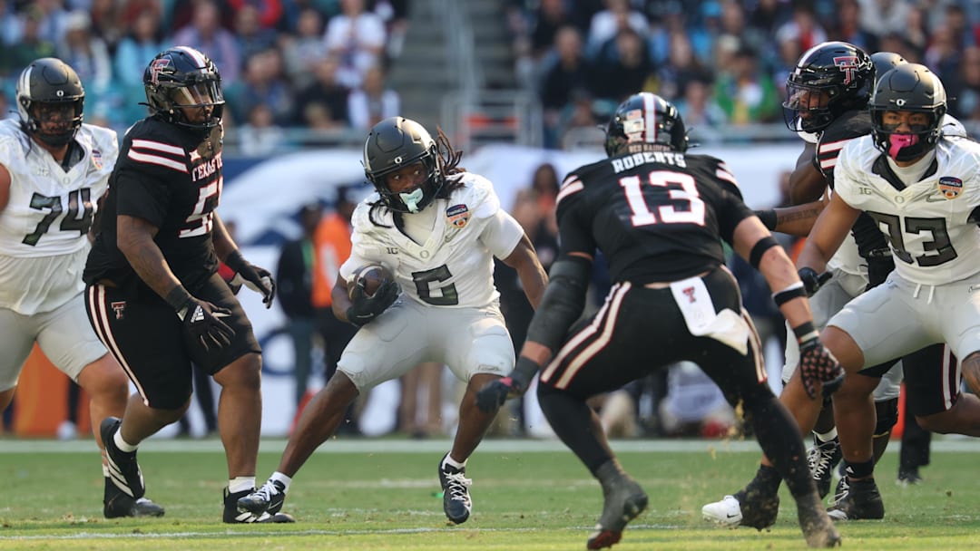 Jan 1, 2026; Miami Gardens, FL, USA; Oregon Ducks running back Noah Whittington (6) carries the ball against the Texas Tech Red Raiders during the first half of the 2025 Orange Bowl and quarterfinal game of the College Football Playoff at Hard Rock Stadium. Mandatory Credit: Nathan Ray Seebeck-Imagn Images