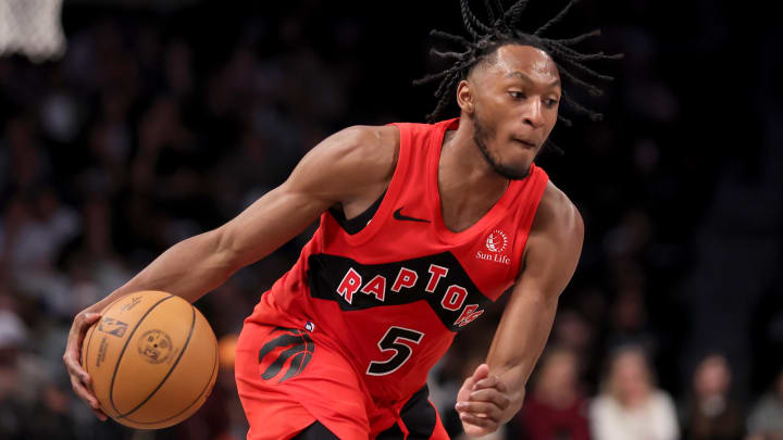 Apr 10, 2024; Brooklyn, New York, USA; Toronto Raptors guard Immanuel Quickley (5) handles the ball against the Brooklyn Nets during the fourth quarter at Barclays Center. Mandatory Credit: Brad Penner-USA TODAY Sports