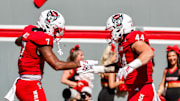 Oct 4, 2025; Raleigh, North Carolina, USA;  NC State Wolfpack tight end Justin Joly (7) and tight end Cody Hardy (44) celebrate a touchdown during the first half of the game against Campbell Fighting Camels at Carter-Finley Stadium. Mandatory Credit: Jaylynn Nash-Imagn Images