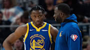 October 30, 2021; San Francisco, California, USA; Golden State Warriors forward Jonathan Kuminga (00) listens to forward Draymond Green (23) during the fourth quarter against the Oklahoma City Thunder at Chase Center. Mandatory Credit: Kyle Terada-Imagn Images