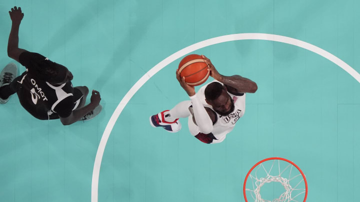 Jul 31, 2024; Villeneuve-d'Ascq, France; United States forward Lebron James (6) dunks against South Sudan small forward Nuni Omot (5) in the fourth quarter during the Paris 2024 Olympic Summer Games at Stade Pierre-Mauroy. Mandatory Credit: John David Mercer-USA TODAY Sports