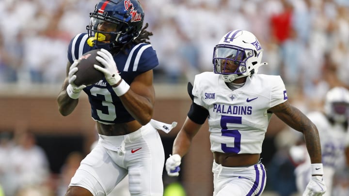 Aug 31, 2024; Oxford, Mississippi, USA; Mississippi Rebels wide receiver Antwane Wells Jr. (3) catches the ball against Furman Paladins defensive back Hysan Dalton (5) during the first half at Vaught-Hemingway Stadium. Mandatory Credit: Petre Thomas-USA TODAY Sports