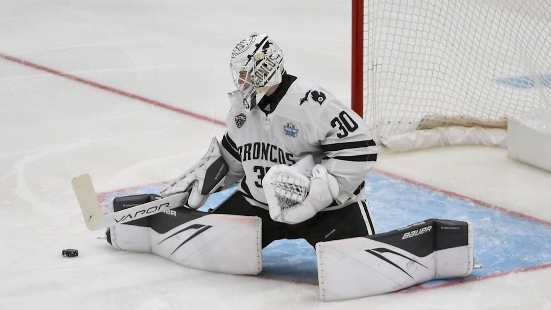 Apr 12, 2025; St. Louis, Missouri, UNITED STATES; Western Michigan Broncos goaltender Hampton Slukynsky (30) defends the net against the Boston University Terriers during the second period of the Frozen Four college ice hockey national championship at Enterprise Center. 