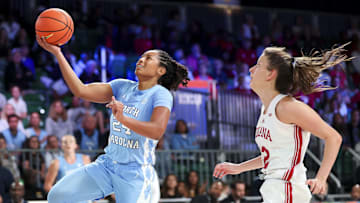 Nov 25, 2024; Paradise Island, Bahamas, BHS; North Carolina Tar Heels guard Indya Nivar (24) drives to the basket as Indiana Hoosiers guard Yarden Garzon (12) defends during the second half at the Atlantis Resort. Mandatory Credit: Kevin Jairaj-Imagn Images